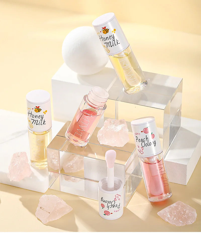 Gloss trattante aroma lattemiele o pesca e vaniglia.